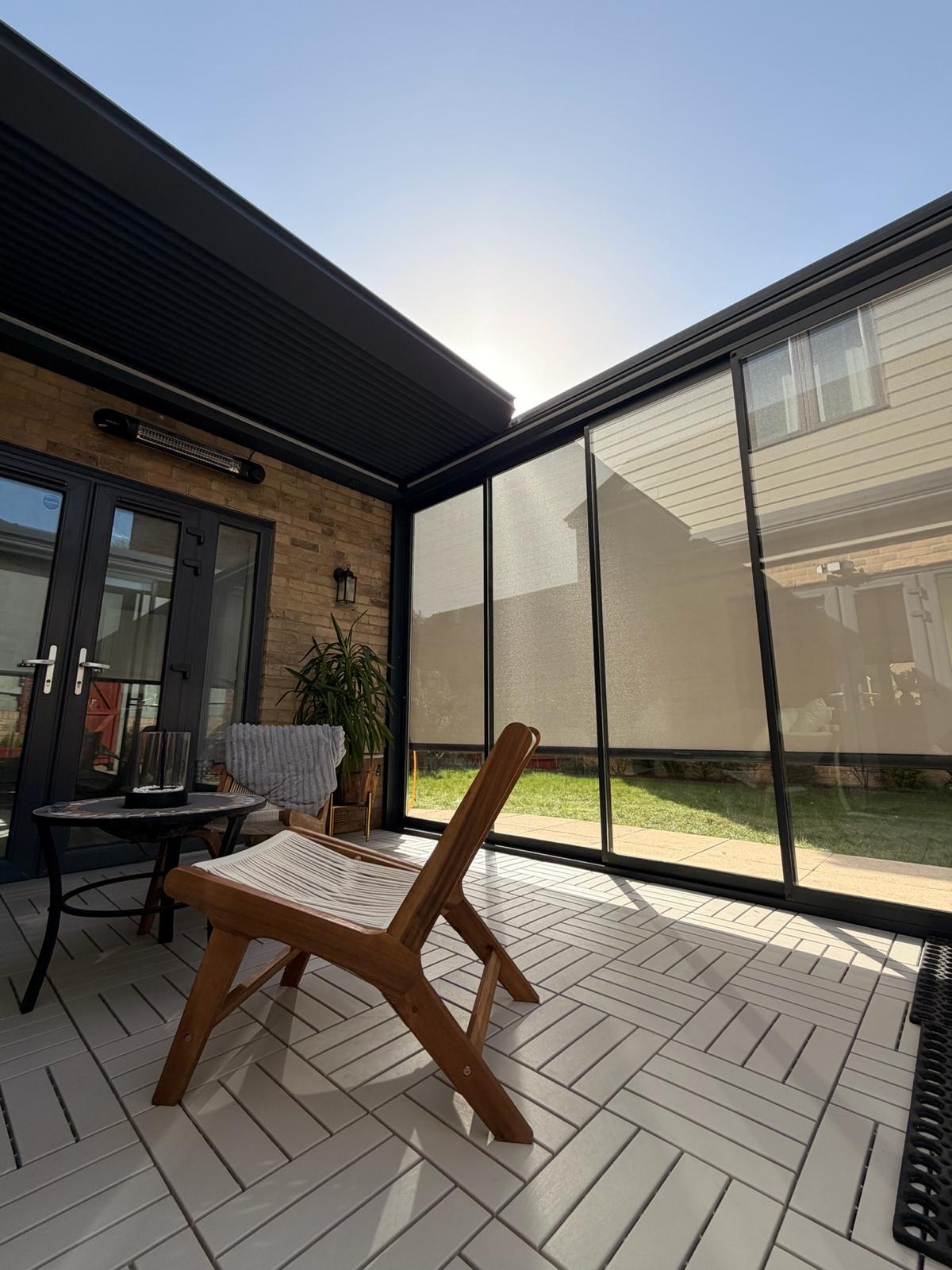 Glazed outdoor room with the roof open